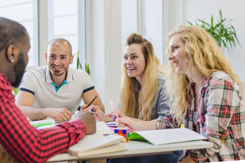 photo-of-four-people-at-table-learning-english-language-at-Mixtree-language-school