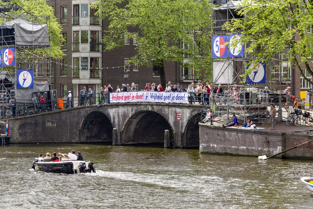 liberation-day-celebrating-amsterdam-amstel-river-netherlands