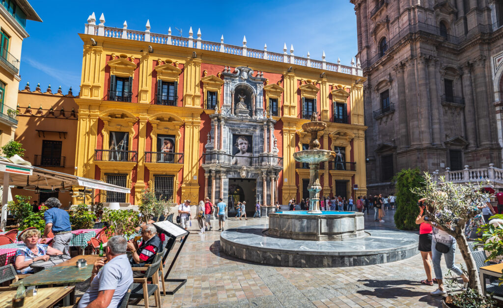 malaga-city-square-with-spanish-architecture-on-sunny-day