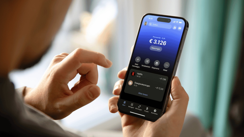 man-checks-his-expenses-on-his-personal-revolut-bank-account-via-mobile-app