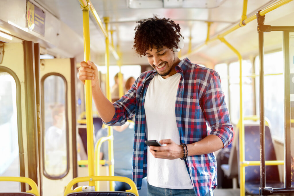 man-scrolling-social-media-on-bus-with-fast-connection-using-LEBARA-cheap-prepaid-sim