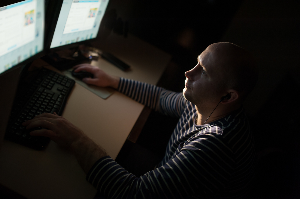 man-staring-at-computer-screen-in-the-dark