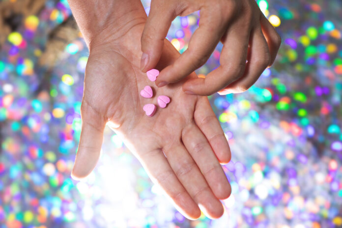 photo-of-ecstasy-pills-on-glitter-background