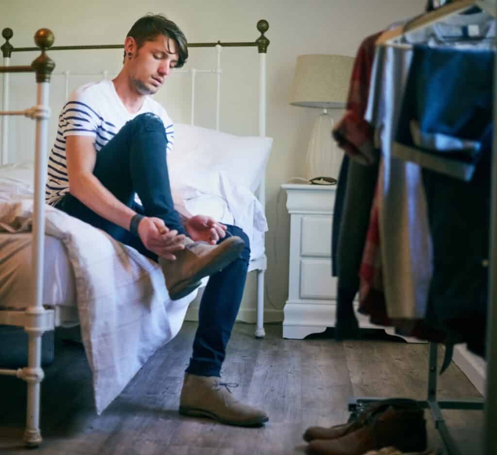 dutch-man-wearing-shoes-inside-the-house