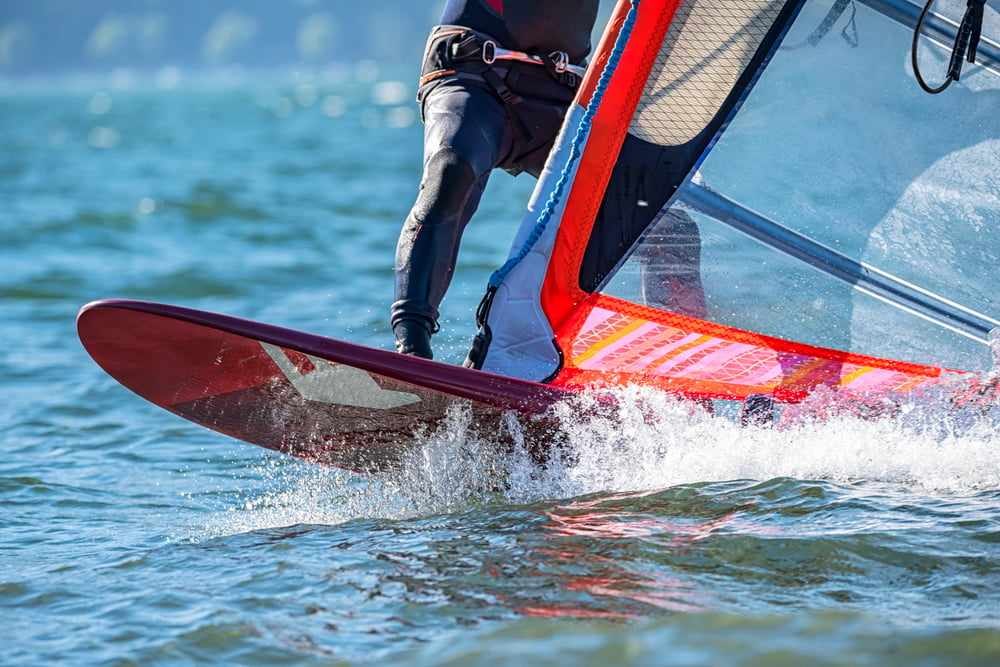 man-windsurfing-on-a-lake-in-giethoorn
