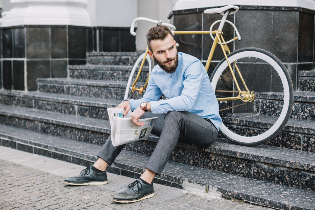 man-with-newspaper-sitting-stairs