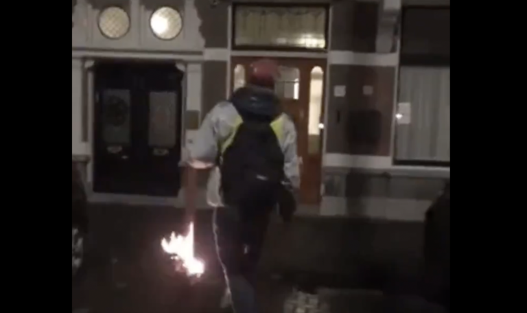 Dutch man arrested for holding a torch in front of a minister’s house
