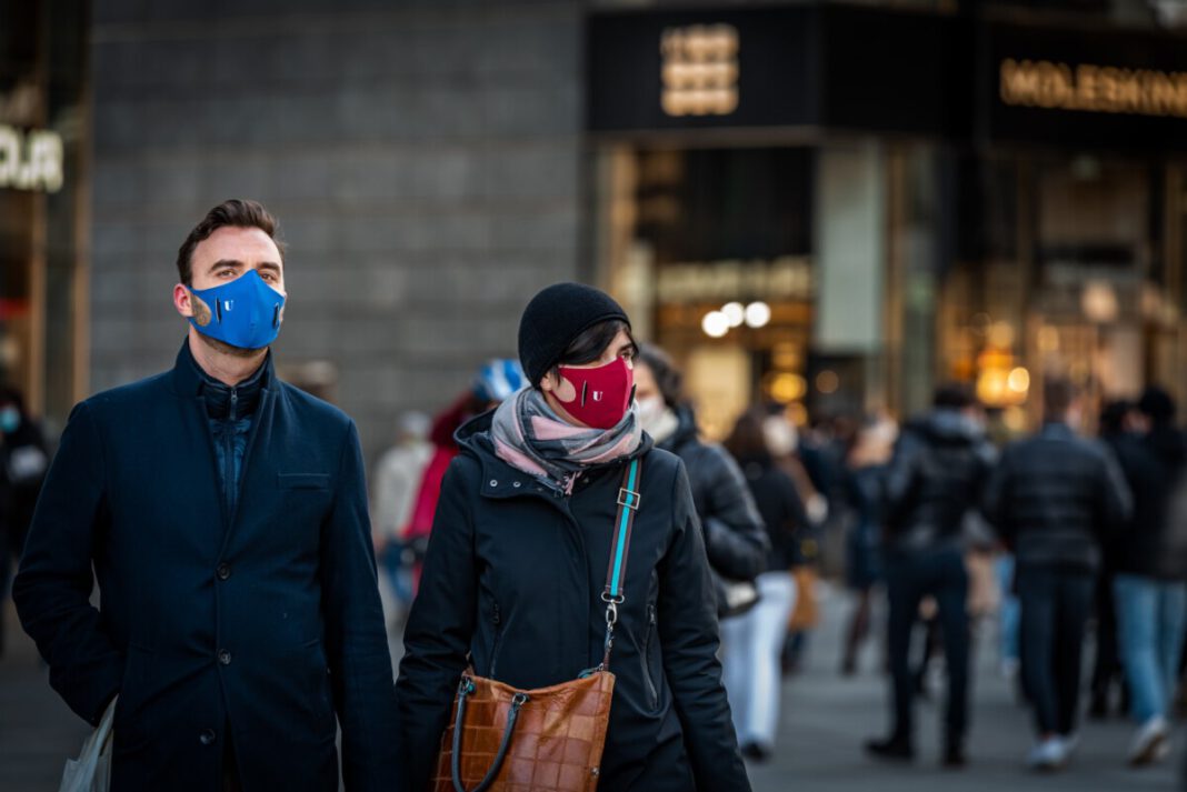 Dutch-woman-and-man-wearing-masks-standing-in-the-street