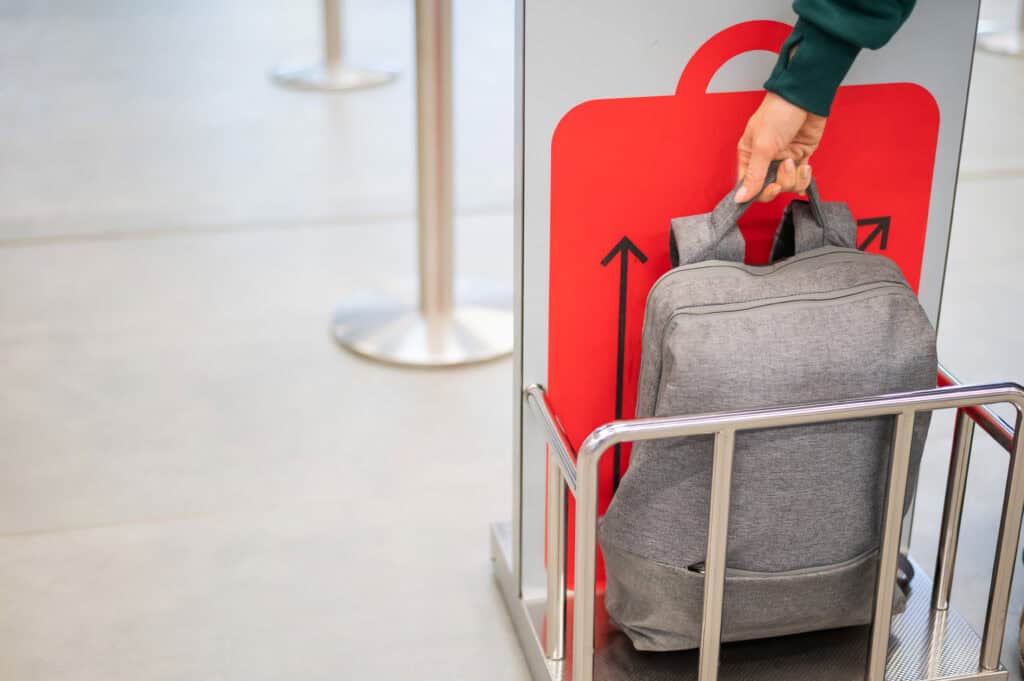 photo-of-a-person-measuring-handbaggage-airport