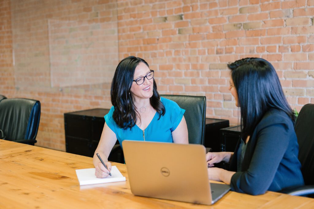 two-female-colleagues-talking