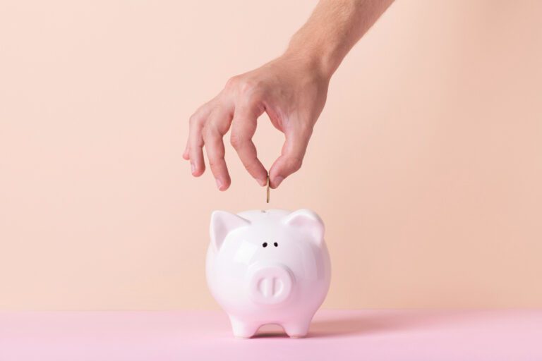 photo-of-hand-dropping-coin-into-jar