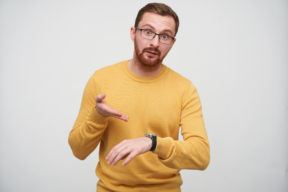 man-gesturing-at-watch-at-late-person