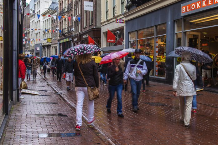 rainy-and-humid-weather-in-the-netherlands-wet-spring-with-people-walking-with-umbrellas-in-the-city