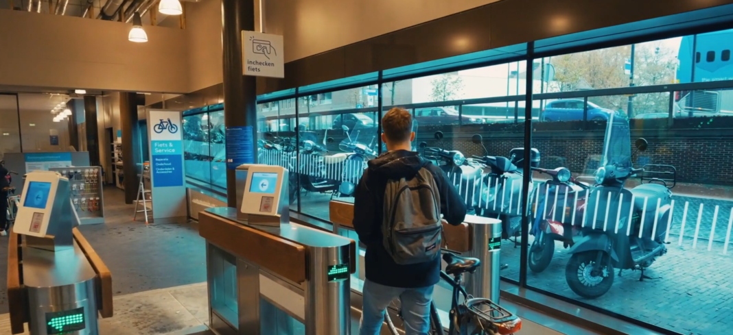 Photo-of-man-using-smart-tag-at-Dutch-train-station-bike-shed