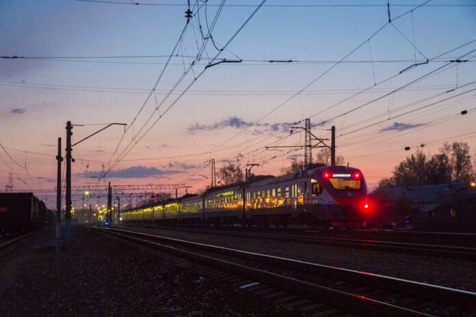 photo-of-train-on-tracks-at-night