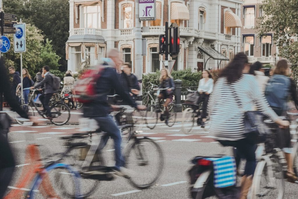 Photo-of-people-cycling-Amsterdam-the-Netherlands-sustainable-transport