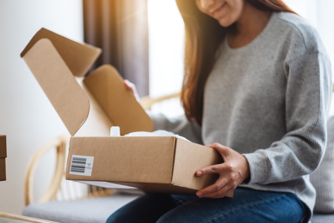 photo-of-woman-receiving-parcel-from-webshop-in-the-Netherlands