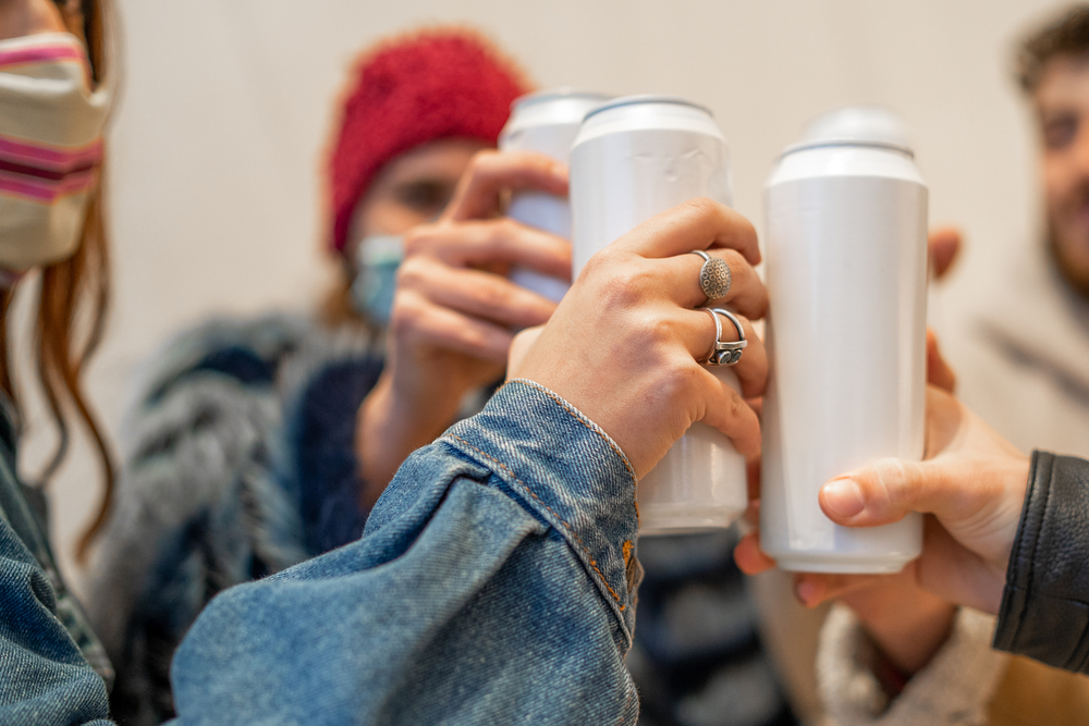 a-picture-of-a-group-of-people-partying-with-cans