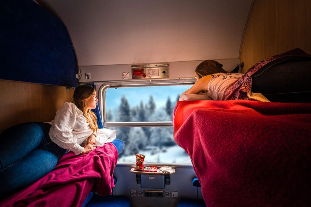 passengers-on-tui-ski-express-look-out-of-window-at-gorgeous-snowy-alps
