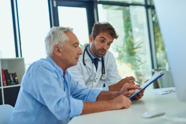 patient-showing-his-dutch-doctor-his-medical-files