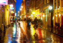 5 things you won’t miss if you leave the Netherlands photo-of-people-cycling-in-amsterdam-street-in-rain