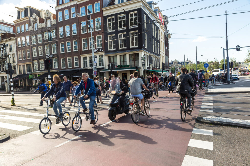 photo-of-people-riding-bikes-on-amsterdam-street