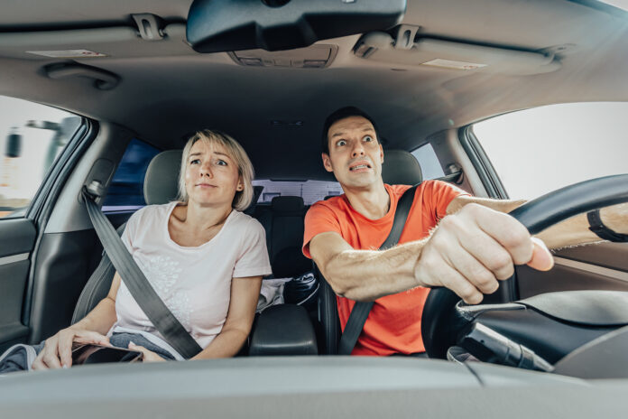 photo-of-people-looking-scared-while-driving-car