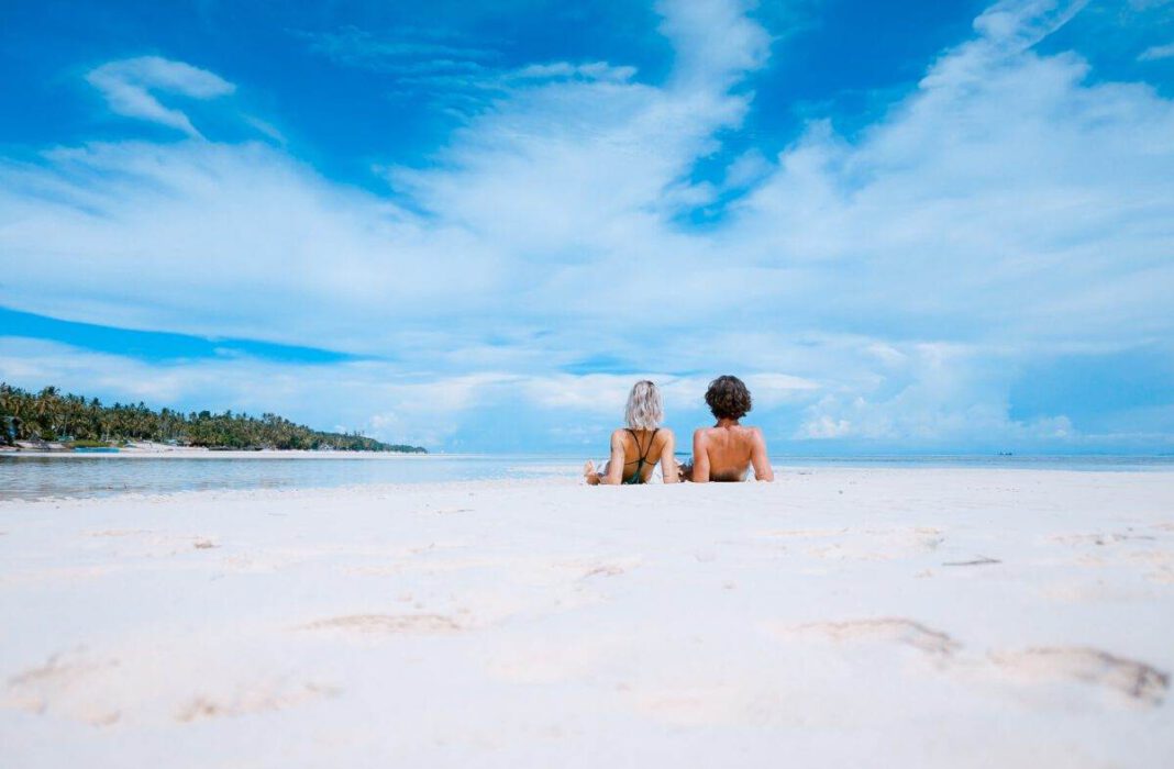 photo-of-people-sunbathing-on-beach-in-sunshine