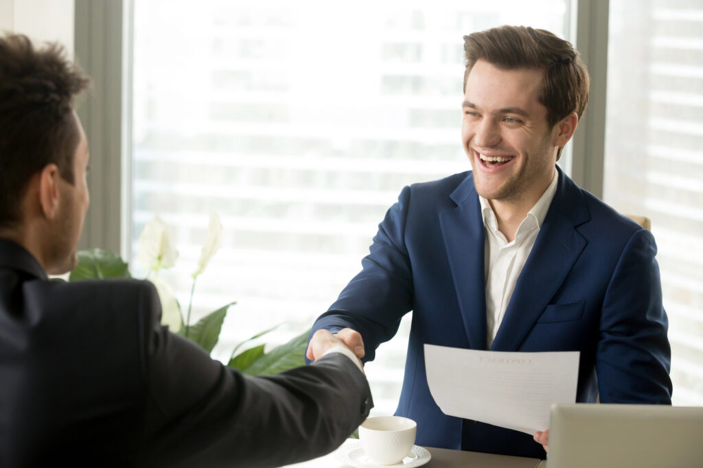 man-signing-job-contract-after-getting-help-from-undutchables