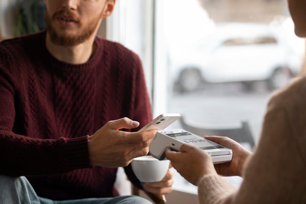 photo-of-person-using-nfc-technology-to-pay-at-bill-restaurant-in-the-netherlands-using-dutch-bank-account