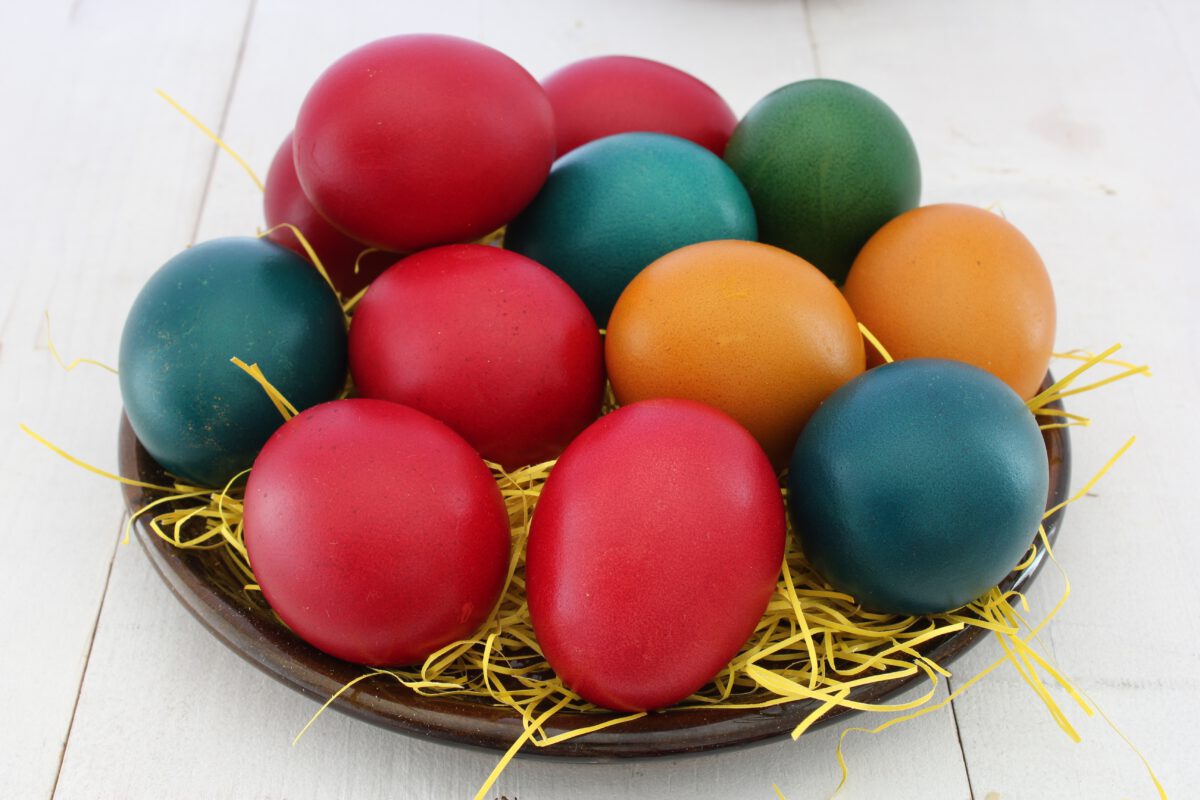 photo of a basket of easter eggs in different colors.