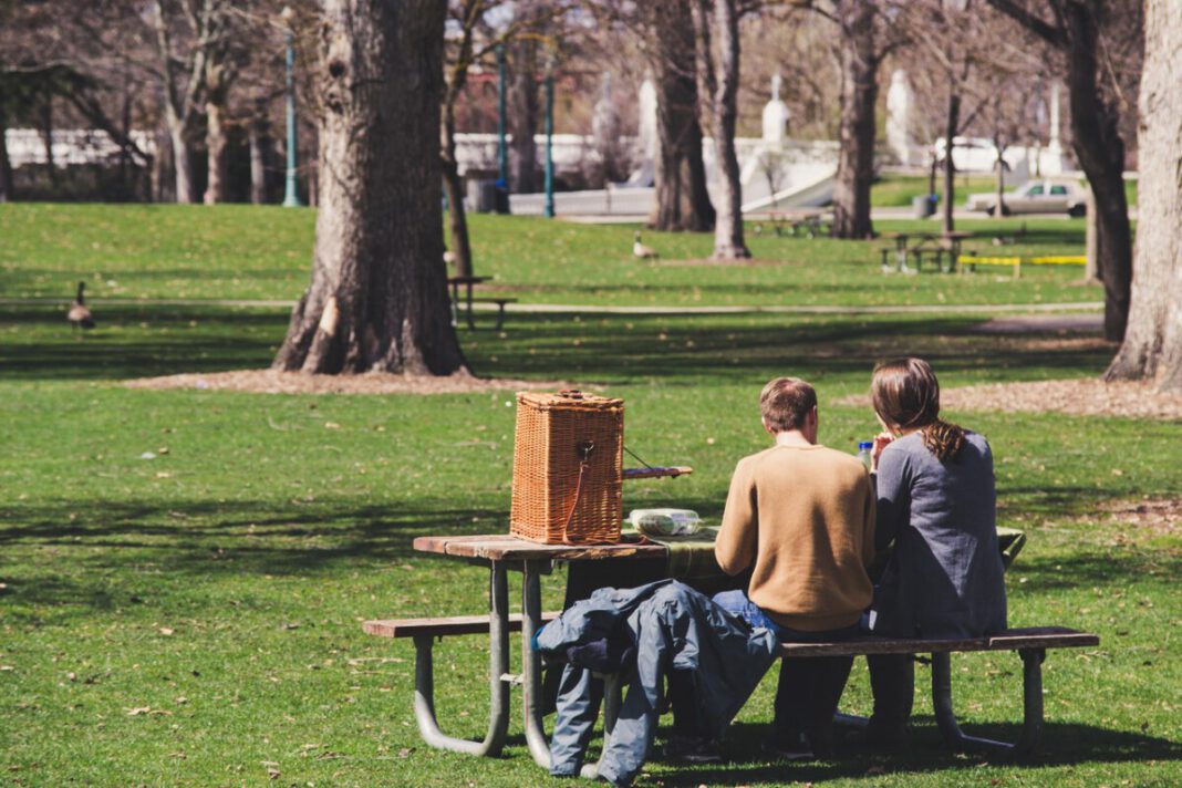 couple-sitting-on-a-bench-in-a-park-in-spring-in-the-Netherlands