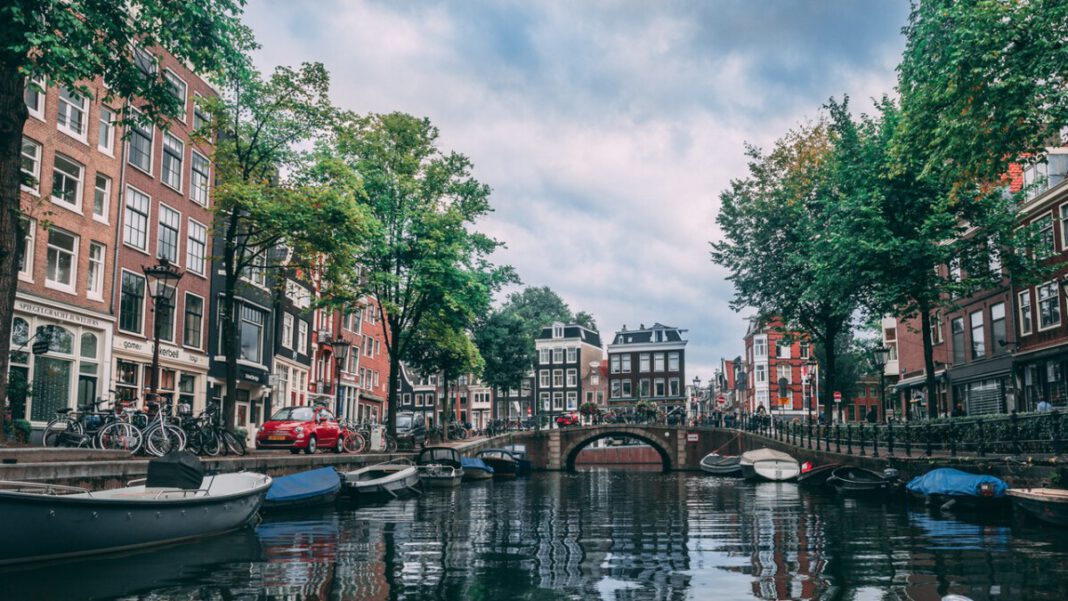 Amsterdam-canal-with-a-bridge