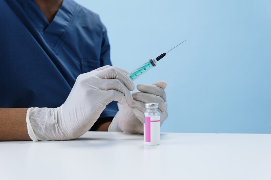 Dutch-woman-holding-AstraZeneca-coronavirus-vaccine