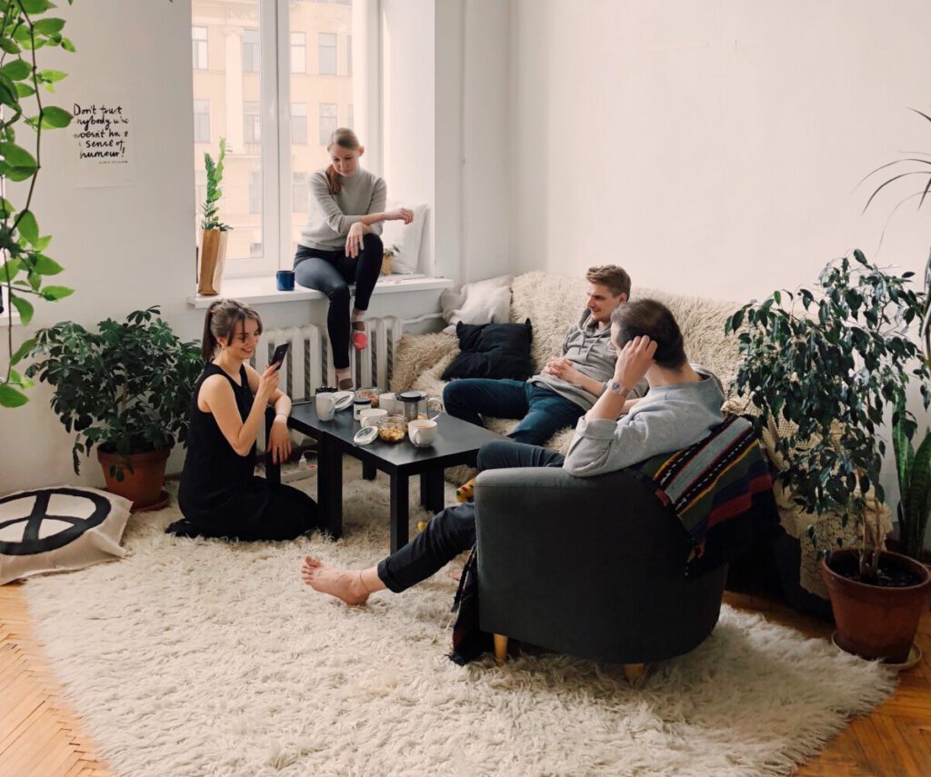 people-gathered-around-a-table -in-the-living-room-in-the-Netherlands