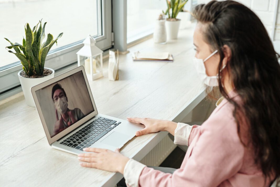 photo-of-a-couple-video-calling