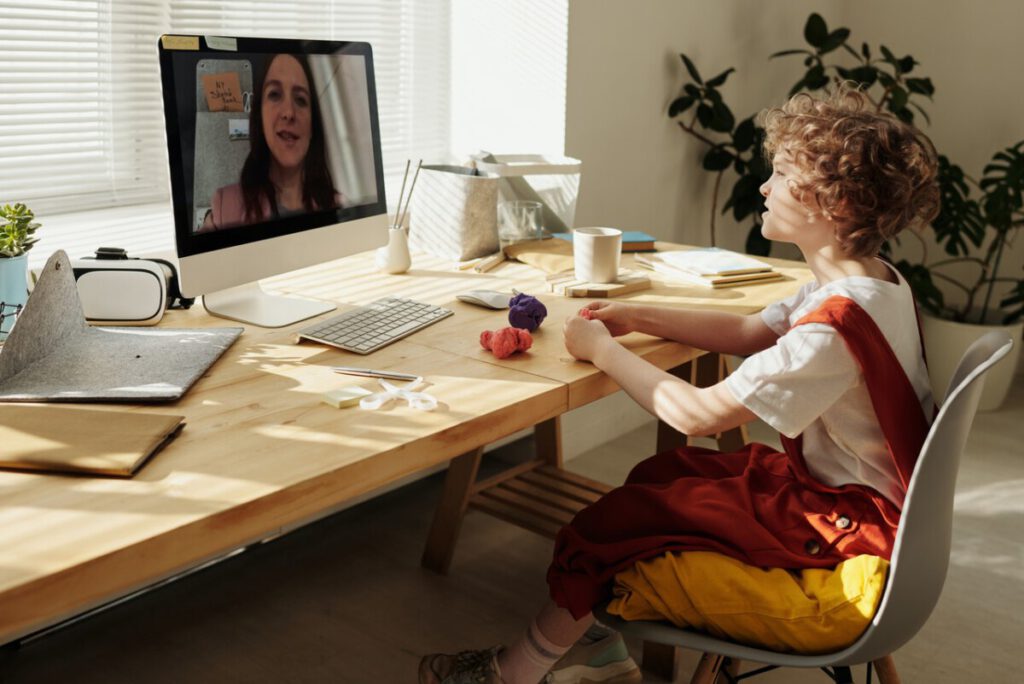 Photo-of-girl-sitting-at-desk-for-online-school