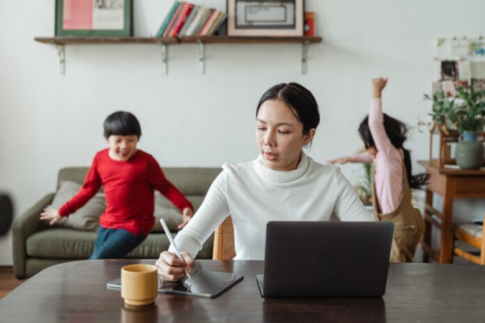 Photo-of-woman-working-from-home-with-kids