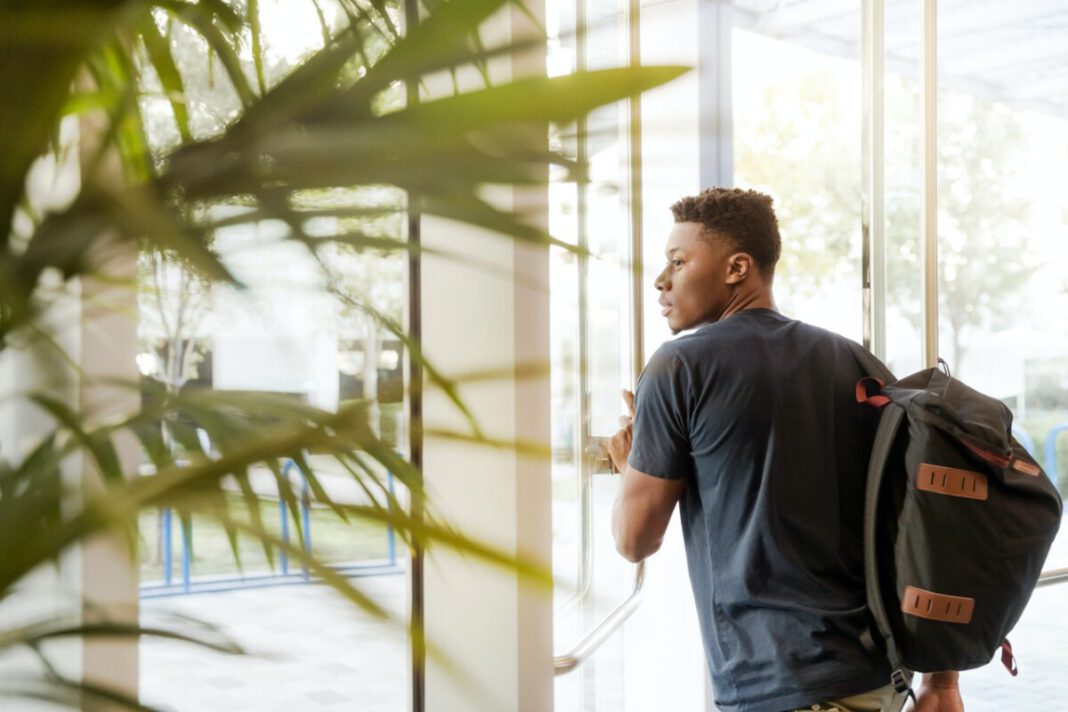 student-leaving-through-door