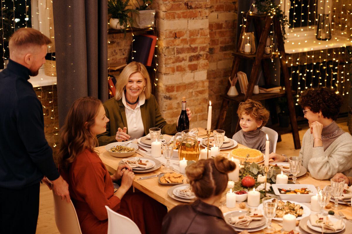 family-celebrating-christmas-having-dinner-together