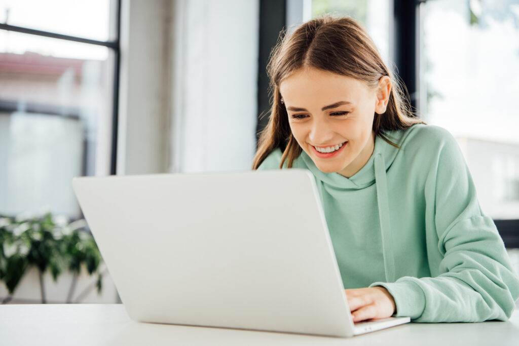 photo-of-girl-in-netherlands-using-laptop-on-internet