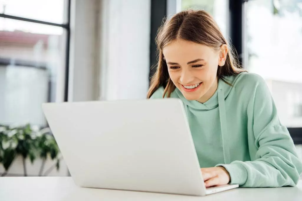 photo-of-girl-in-netherlands-using-laptop-on-internet