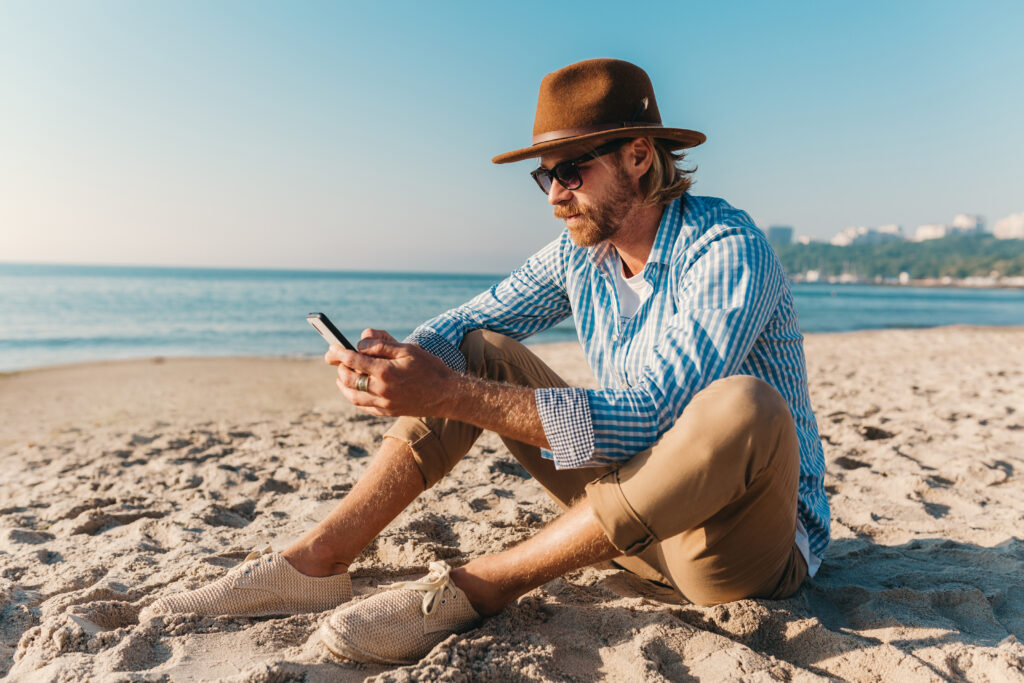 photograph-of-a-man-scrolling-on-his-mobile-phone-with-a-dutch-sim-only-plan