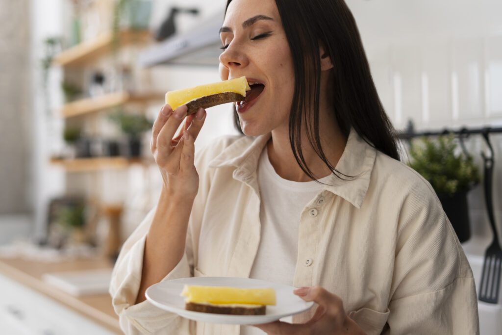 photograph-of-a-tall-dutch-woman-eating-a-cheese-sandwich