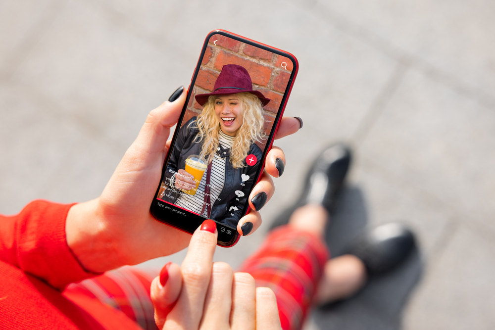 photograph-of-a-woman-scrolling-through-TikTok