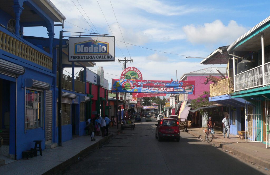 picture-of-street-with-signs-banners-people-in-bluefields-nicaragua