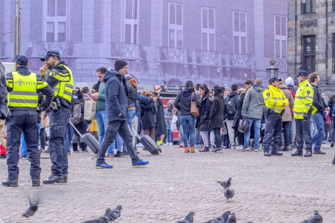 photo-of-crowds-and-police-on-amsterdam-dam-square