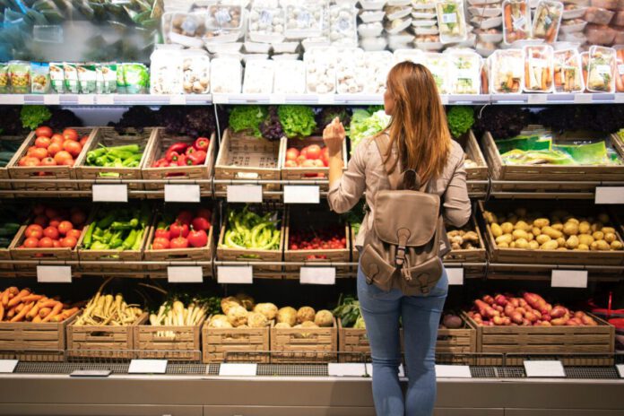 photo-of-woman-choosing-groceries-in-dutch-supermarket