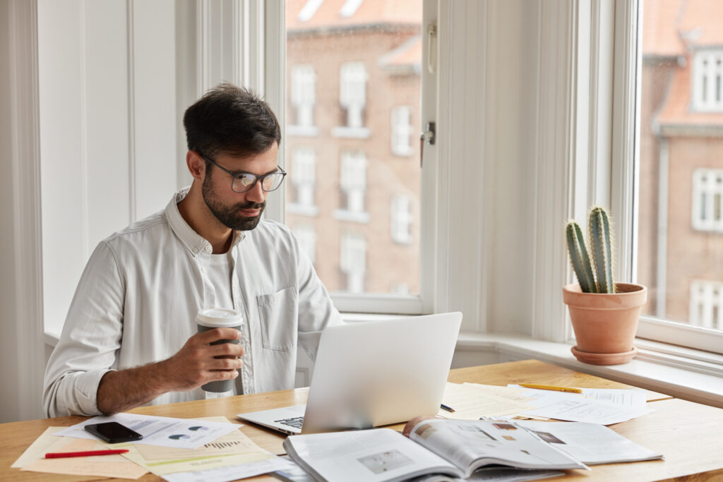 freelance-it-developer-going-through-his-invoices-and-vat-returns