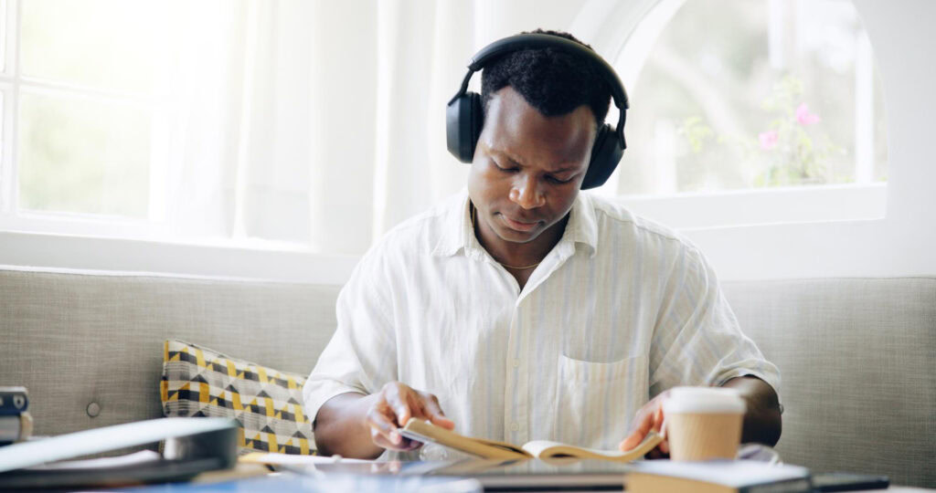 photo-of-man-looking-at-book-while-studying-for-inburgeringsexamen-netherlands